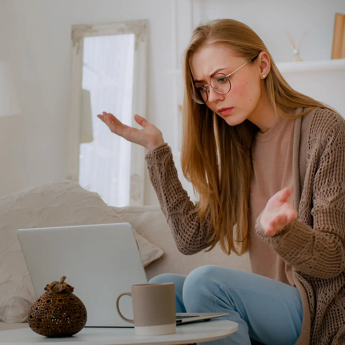 Person frustrated with slow website on laptop